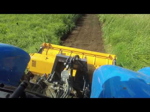 Видео: Что делать с заросшим полем? Трактор New Holland T6090 с финским ротоватором Mericrusher MJ 2.3DT