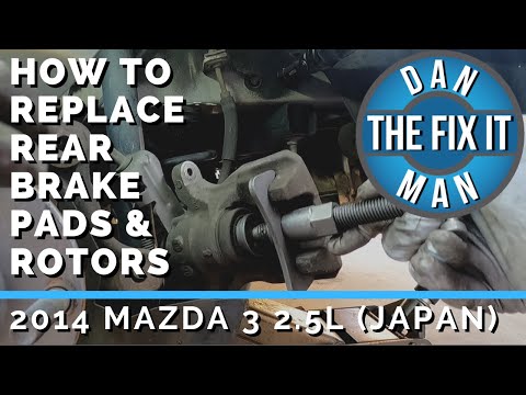 Видео: MAZDA 3 2.5L 2014 года выпуска. Как заменить задние тормозные колодки и диски (сделано в Японии) ...