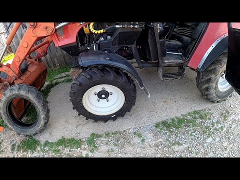 Видео: МЕНЯЕМ РЕЗИНУ на тракторе МТЗ 320.4