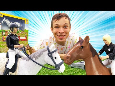 Видео: Распаковка Bruder. Игровой набор. Лошадки прыгают через барьеры