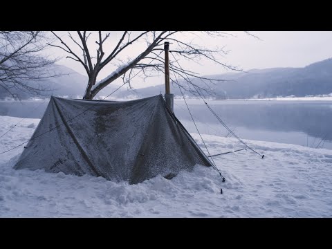 Видео: Горячий палаточный кемпинг в снегу на берегу озера