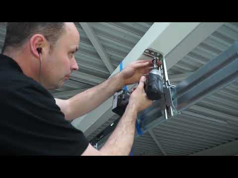 Видео: Монтаж гаражних воріт Nova з торсійними пружинами (стандартний монтаж)