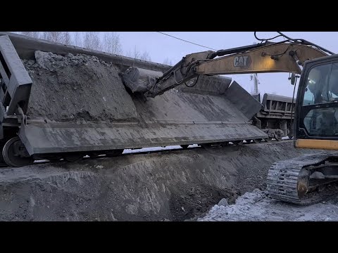 Видео: Зачистка думпкаров. Намерзание горной массы. Костомукшский ГОК | Industrial video