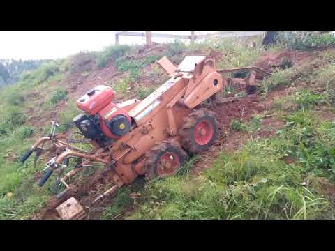 Видео: Работа траншеекопателем KAWABE 727 17 л.с,бара,грунторез