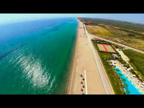 Видео: Abovе Kalyves Beach Greece.Плаж Каливес Гърция от високо. 4K RELAXING VIDEO GREECE