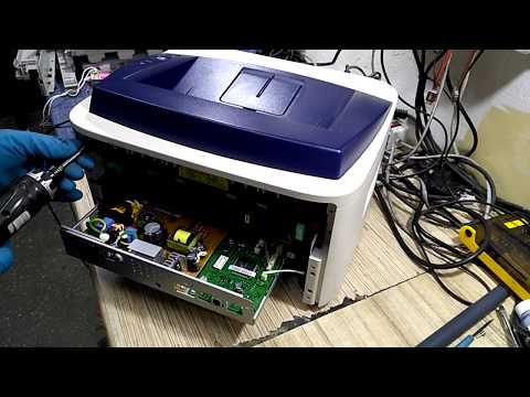 Видео: Инструкция ремонт Xerox Phaser 3140 щелкает не выходит в готовность