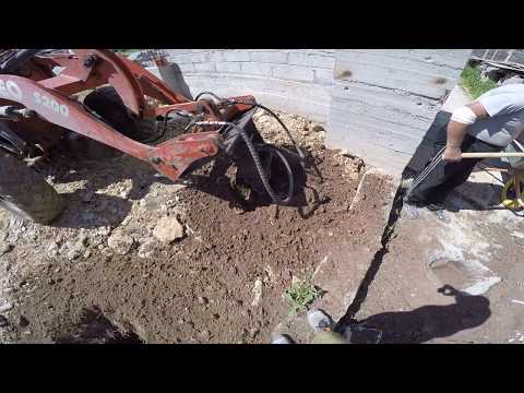 Видео: Работа с ямобуром на фронтальном погрузчике