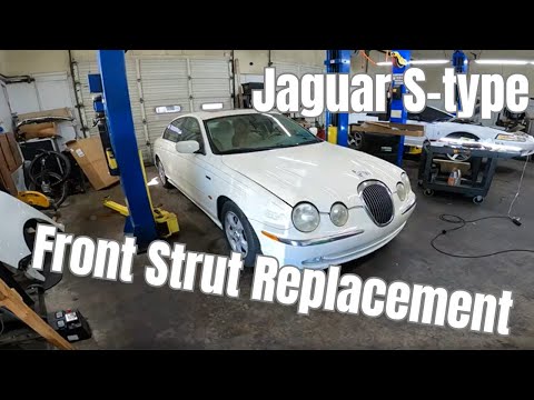Видео: Замена передних стоек Jaguar S-type 2000 года