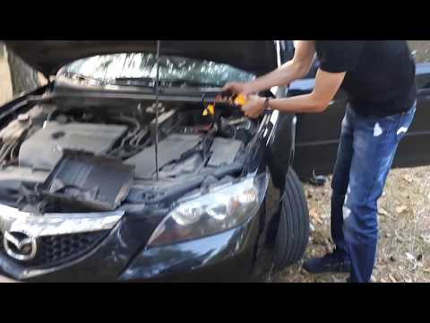 Видео: Hummer Power Bank Jump Starter заводим 52 раза Mazda 3 (2L)