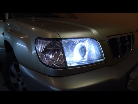 Видео: Subaru Forester тюнинг фар Установка светодиодных би модулей Optima и ангельских глазок