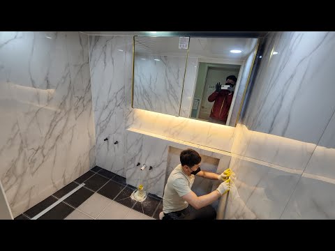 Видео: Строительство интерьера ванной комнаты, которая заканчивается в один день