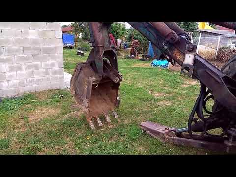 Видео: Делаем отмостку экскаватором ЮМЗ ЭО-2621