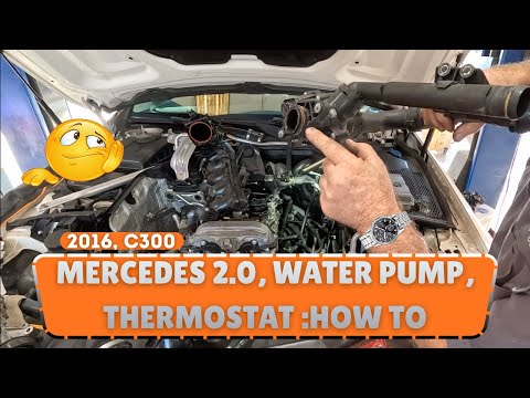 Видео: 16. Инструкции по замене водяного насоса и термостата для Mercedes C300. Из нашей серии «День в м...