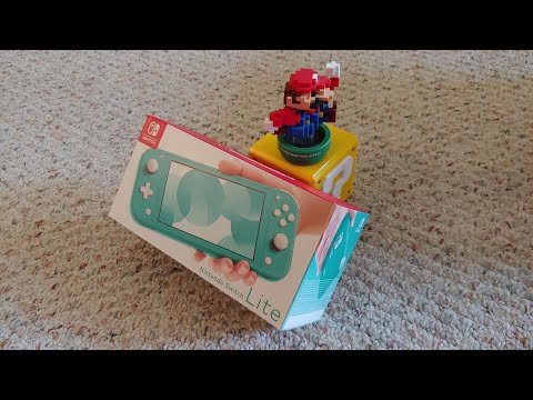 Видео: Распаковка и мини-обзор Nintendo Switch Lite!
