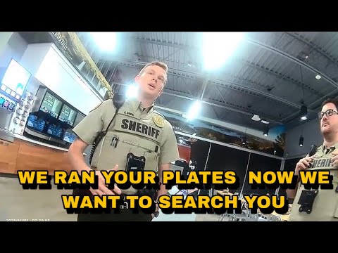 Видео: Полицейские остановили мужчину на заправке и подвергли его выборочному обыску