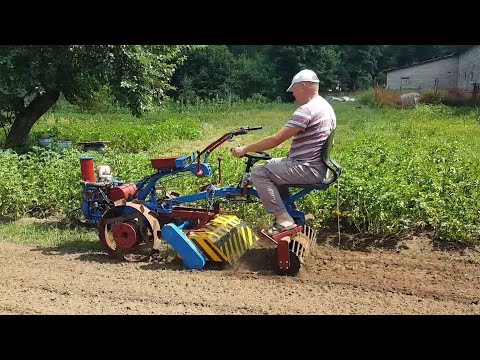 Видео: Фрезеровка мотоблоком МТЗ на железных колесах.