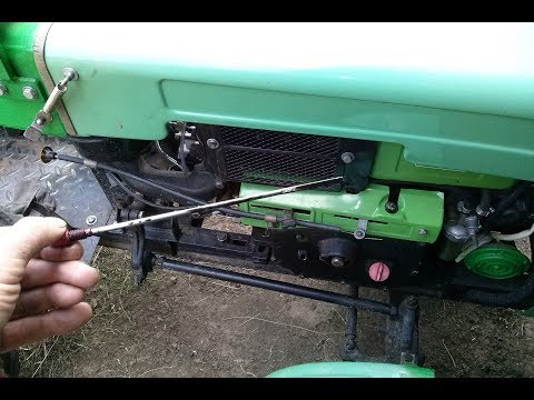 Видео: Проверка уровня масла двигателя мототрактора (мотоблока).