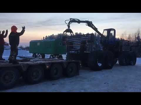 Видео: Форвардер Тром 20 УЭС погрузка на трал без сходней