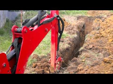 Видео: МТЗ 320 с навесным экскаватором