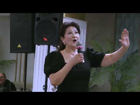 Видео: Песню Туманган поёт Лариса Хван