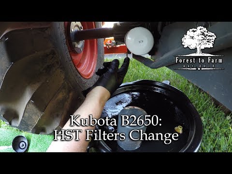 Видео: Kubota B2650: замена фильтров HST