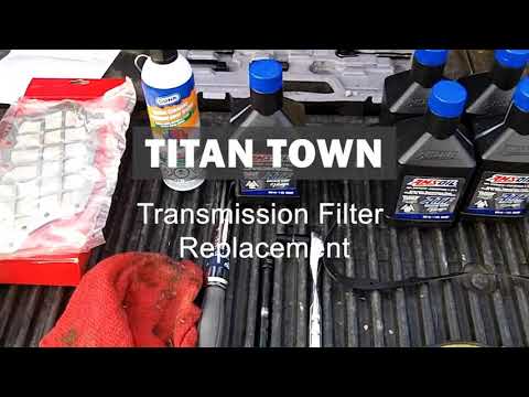 Видео: Замена трансмиссионного фильтра и жидкости Nissan Titan Armada | Очистка поддона.