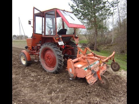 Видео: Фрезерование земли с фрезой Kubota на Т-25