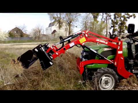 Видео: Челюстной погрузчик к минитрактору