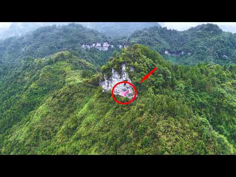 Видео: На скале в провинции Хунань, Китай, были обнаружены красные дома. Они действительно впечатляют.