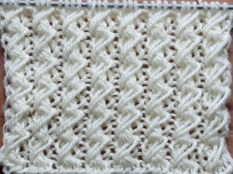 Видео: Вязание спицами. Вертикальный узор для пуловера , свитера, кардигана, жилета