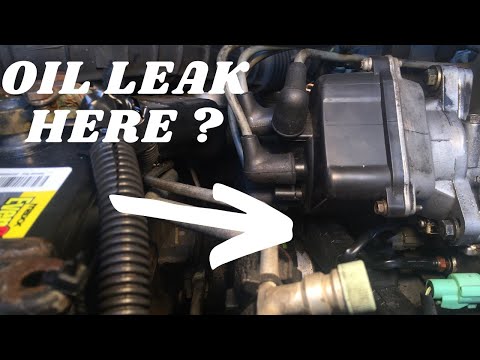 Видео: Ремонт утечек масла у дистрибьютора Honda (уплотнения)