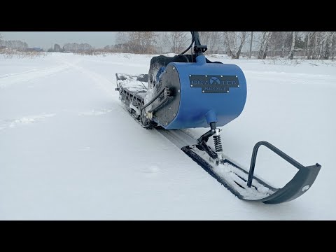 Видео: катаемся по горкам на мотоснегокате  DRAXTER