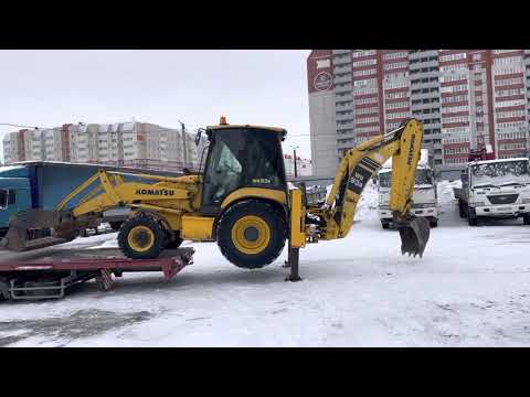 Видео: Погрузка Komatsu на трал без сходней