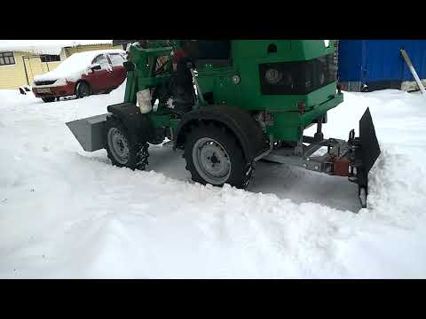 Видео: Работа одновременно и отвалом и ковшом