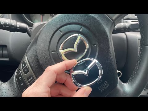 Видео: Замена значка на руле на примере Mazda 3