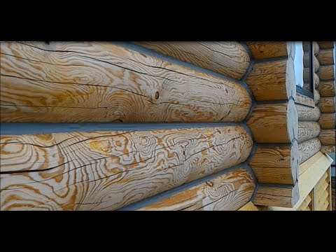 Видео: Заделка трещин в бревне и брусе герметиком. Заделка щелей герметиком Теплый ШОВ для бревна и бруса.