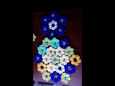 Видео: Объемные цветы из остатков пряжи.