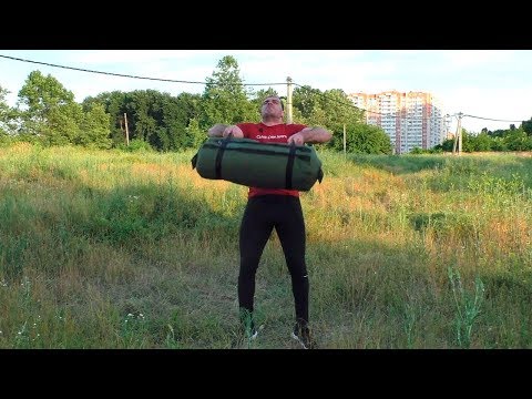 Видео: Бросок сэндбэга через голову: техника выполнения