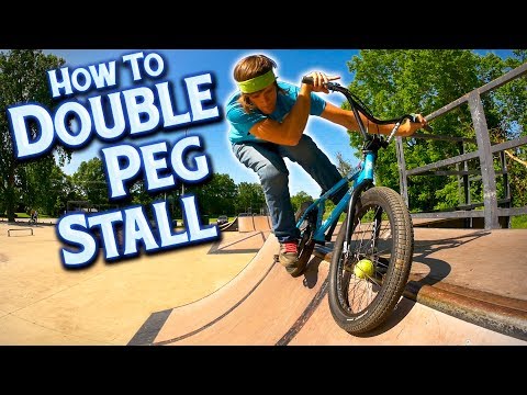 Видео: Как кататься на BMX Double Peg Stall на четверть трубы