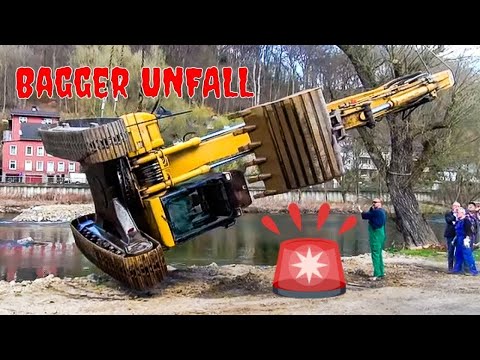 Видео: Экскаватор в реке - используется подъемный кран