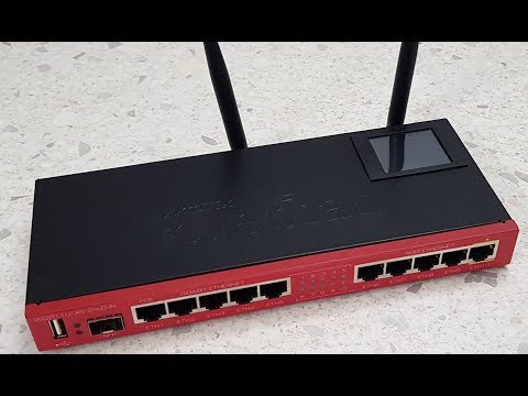 Видео: ОНЛАЙН ТРЕЙД.РУ Беспроводной маршрутизатор (роутер) Mikrotik RB2011UiAS-2HnD-IN