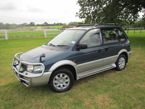 Видео: МИНИ ОБЗОР: MITSUBISHI RVR 2.0 SPORTS GEAR