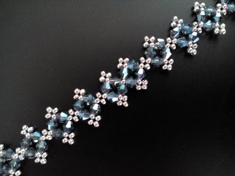 Видео: Браслет из бисера и биконусов. Мастер-класс. Tutorial: beaded bracelet