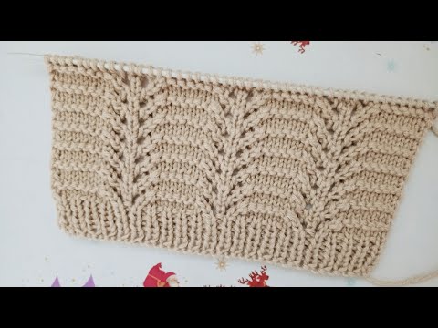 Видео: Красивый рельефный узор с вертикальными ажурными дорожками спицами.