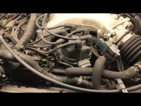 Видео: Замена катушки зажигания Nissan Frontier V6 2000 года (катушка находится внутри распределителя)