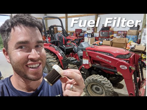 Видео: Как заменить топливный фильтр трактора Mahindra 1626