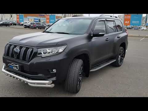 Видео: Toyota Land Cruiser Prado - оклейка черной матовой пленкой, шумоизоляция, доводчики, установка линз