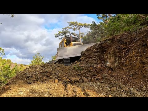 Видео: Профессиональный оператор бульдозера Caterpillar D7g, работы по резке и выравниванию склонов