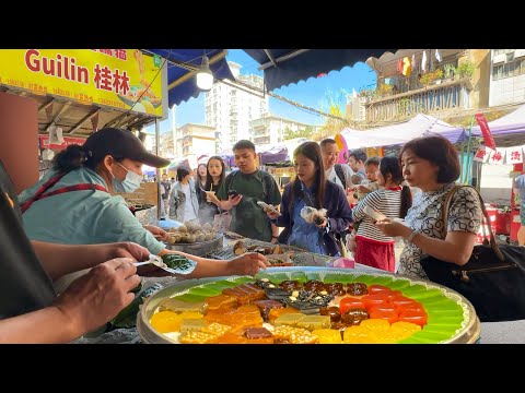 Видео: Утренний рынок в Гуанси, Китай: вяленая свинина, желейные пирожные, пельмени с креветками, жаркое