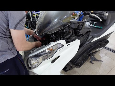 Видео: Обслуживание вилки Suzuki Burgman Skywave k7 ч6 (Сборка переднего пластика)